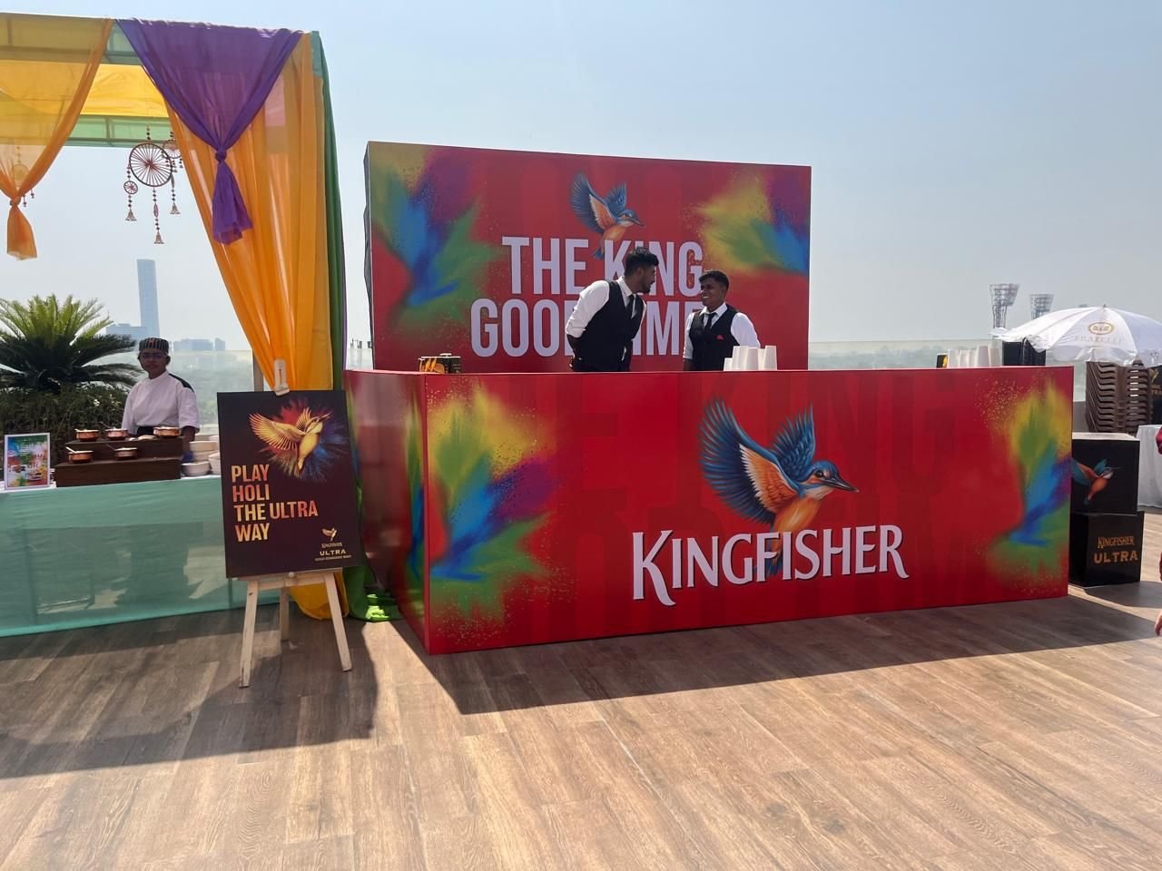 Sponsor bar counter with custom printed fascia and backdrop at a rooftop festival