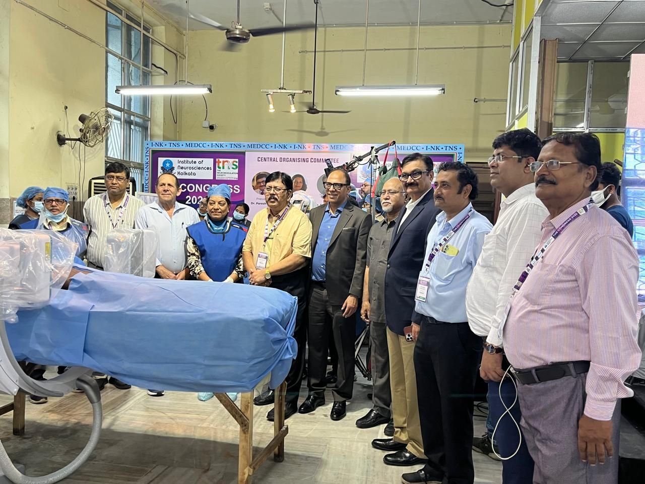 Delegates gathered around a hands-on workshop demonstration station at a conference